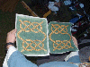 Matching scrolls of the Order badge with the text in the knotwork done by Baroness Julianna Fiorentini. Click here for full size image.