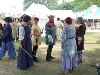 Sara and Merowald lead a group of Morris Dancers. Click here for full size image.