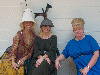 Wacky hats abound as modeled by this woman with Deirdre and Rhiannon. Click here for full size image.